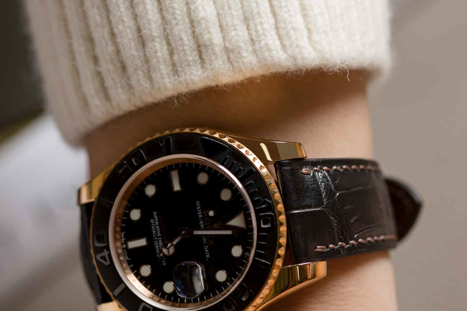 Alligator leather watch strap worn on the wrist, showing how the scale tiles sit once the strap is curved, manufactured by AKC